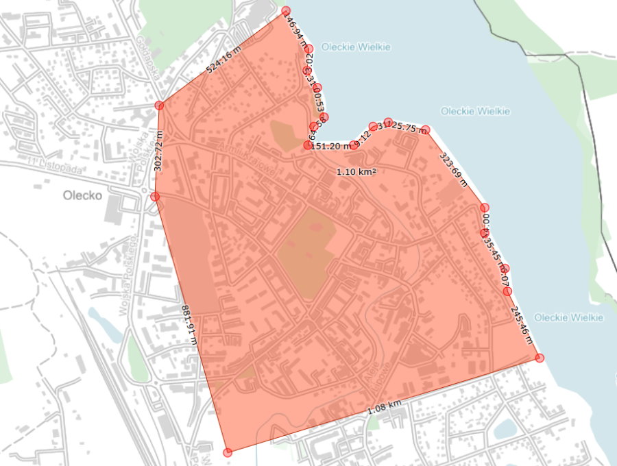 Mapa z zaznaczonym obszarem pomiarowym wyróżnionym kolorem, przedstawiająca granice działki lub terenu.